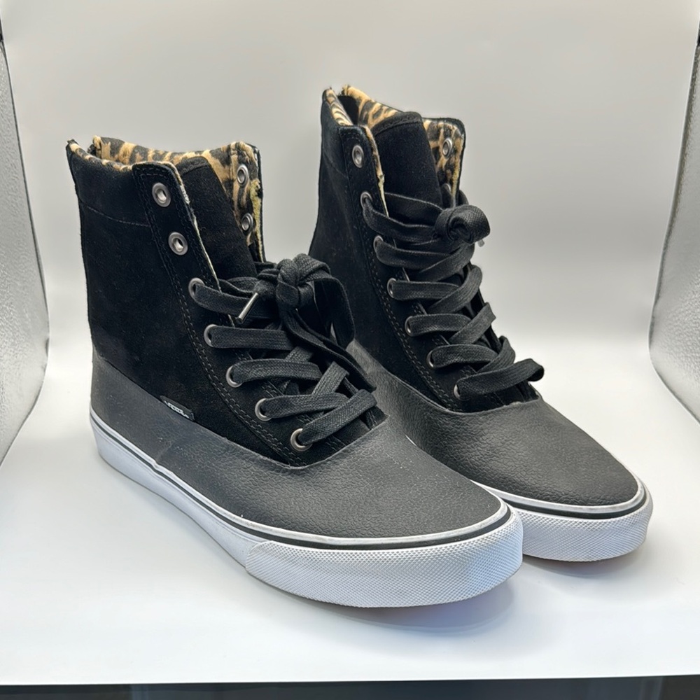 Vans Sk8-Hi Slim Zip Black High-Top Sneakers with Leopard Print Interior.